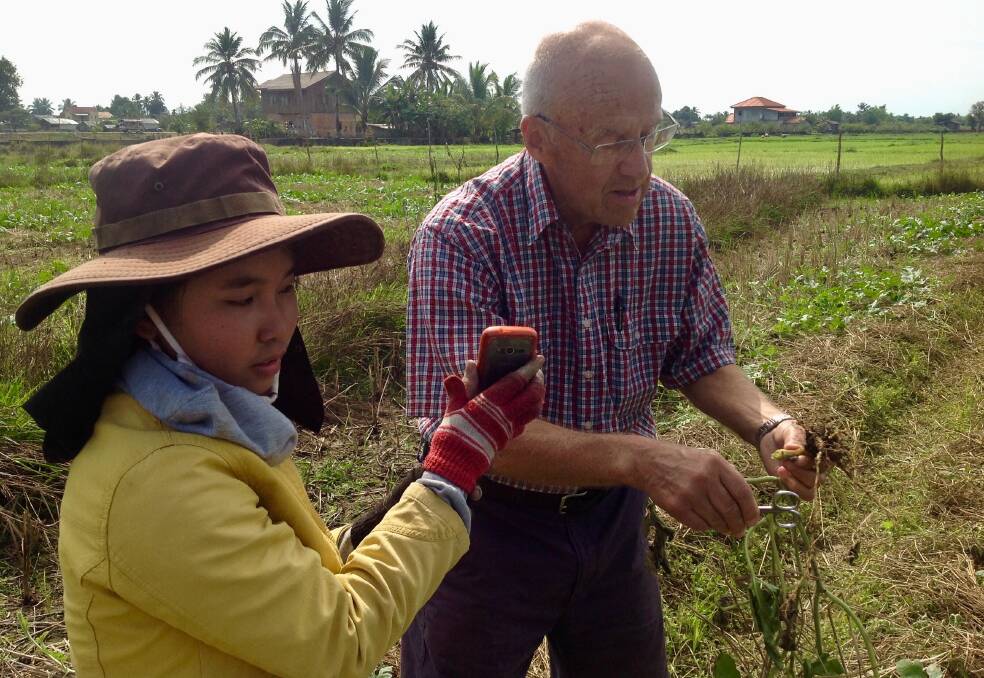 Dr Burgess with a Year 11 student who was helping her mother on their small watermelon farm near Champasak, Laos. Picture supplied