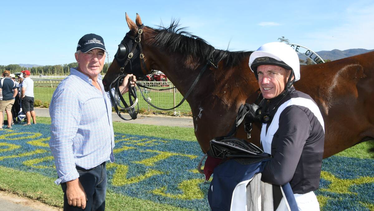 Champion Dubbo based jockey Greg Ryan unsaddles Healing Hands with strapper Frank Williams after winning the Central Districts Country Championship Qualifier at Mudgee on Sunday. Photos by Virginia Harvey.