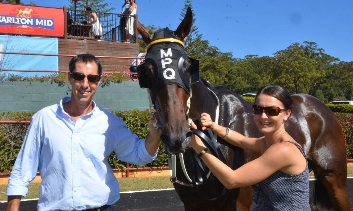 Trainer Marc Quinn with his winner Gumshoe and strapper Jess Hosie, after winning the Class Two Country Plate at Port Macquarie. Photo Virginia Harvey