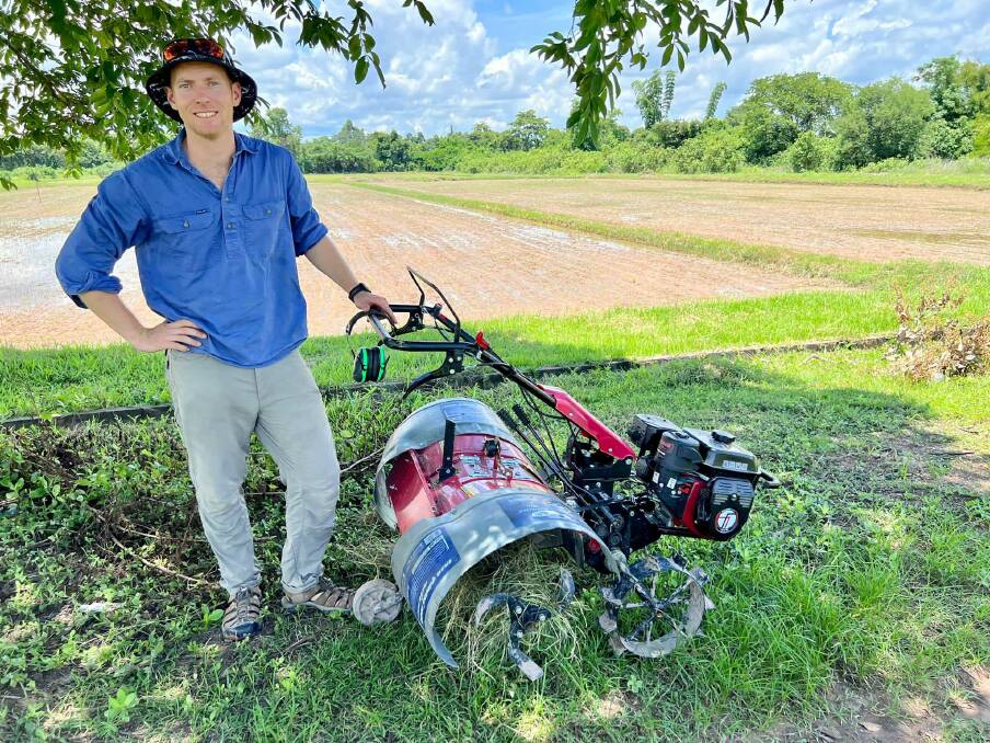 Dr Matt Champness with a self-propelled rotavator modified for inter-row weed control in direct seeded rice, Savannakhet Laos. Picture supplied