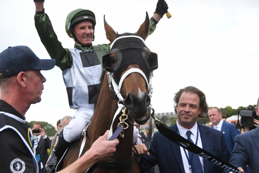 Strapper Mick Channon Jnr with Yes Yes Yes and winning jockey Glen Boss aboard, and part-owner Tom Magnier after the colt won The Everest at Randwick on Saturday. Photo Virginia Harvey