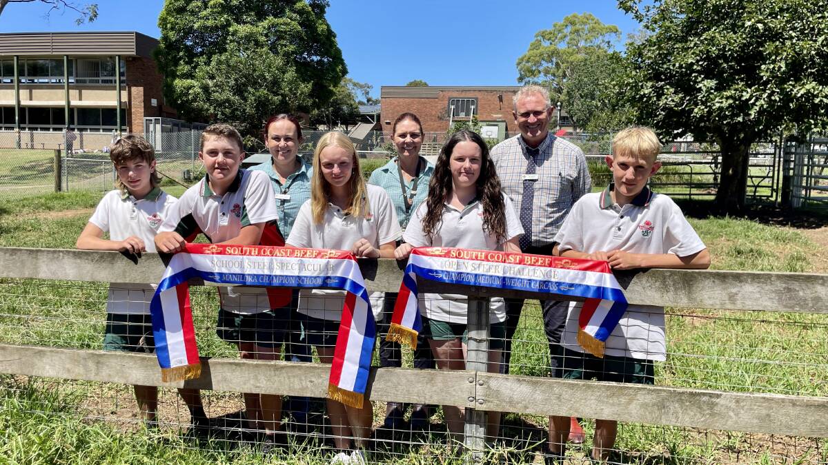 (Back) Mrs Renee Lidgard, Mrs Bronwyn Hilaire, and Mr Ian Morris. (Front) Luke, Sam, Mia, Iris, and Dane, with the champion ribbons, the ag team won at the 2023 South Coast Beef School Steer Spectacular. Picture by Hayley Warden