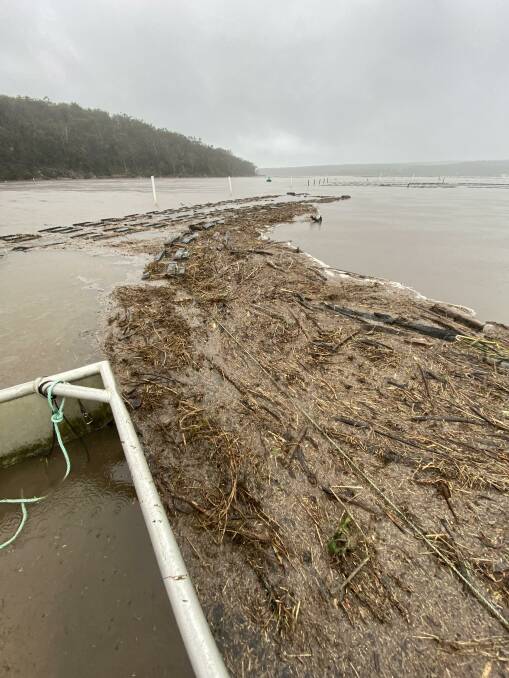 Debris damaged oyster leases on Pambula Lake. This photo was taken on November 30, 2023, following extreme rainfall. Picture supplied by Pambula Lake oyster farmers