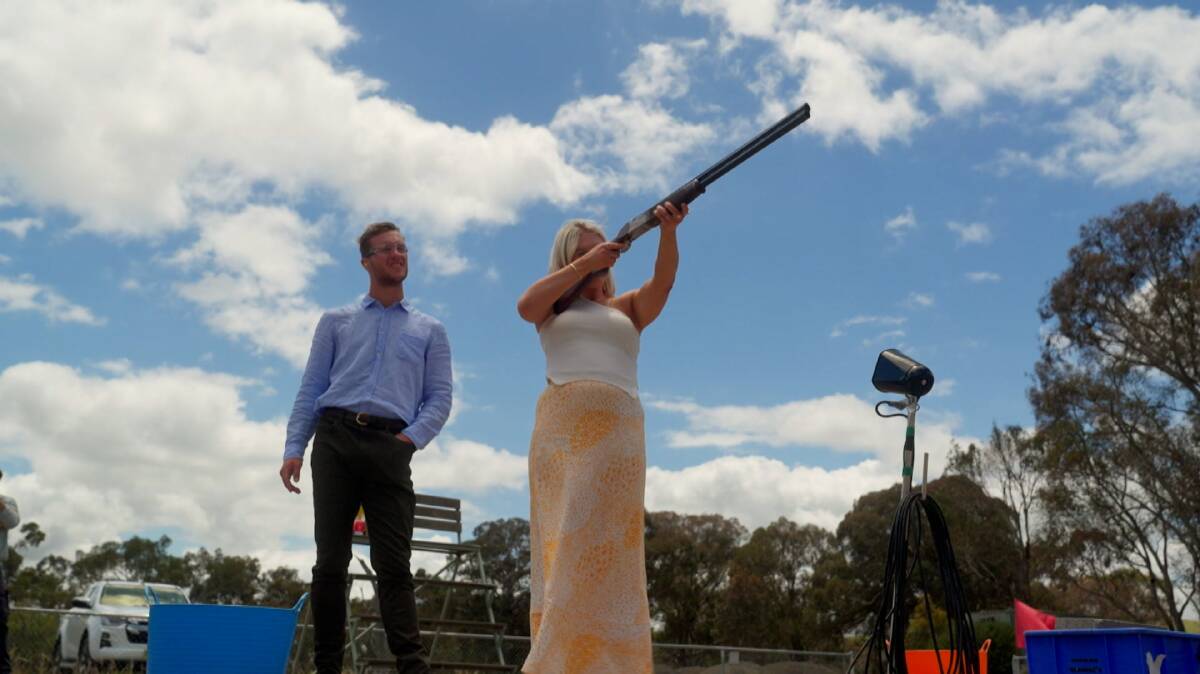 Farmer Matt and Chelsea enjoy some target shooting. Picture by Channel 7