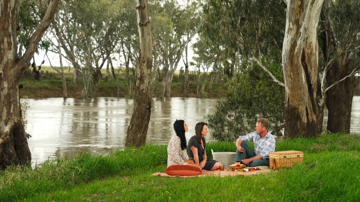 Farmer Andrew takes Claire and Kelly on a riverside picnic. Picture by Channel 7
