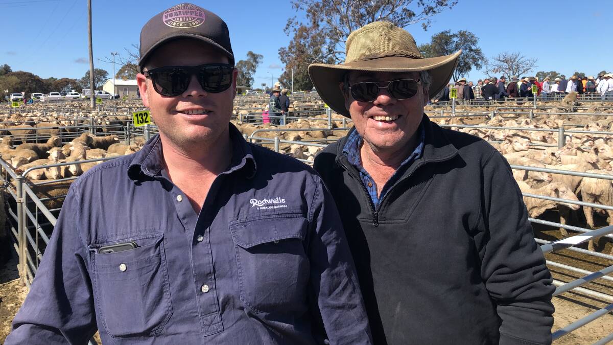 OUT AND ABOUT: Ryan Hussey, Rodwells Wangaratta, with client John Fuge, who sold suckers for a top of $192 a head at Corowa, NSW.