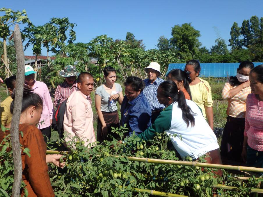 Professor Lester Burgess (white hat) in the field with Laos research partners. Picture supplied