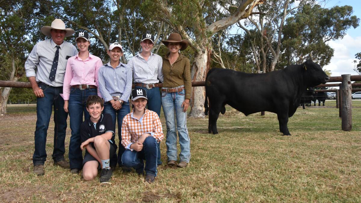 Stuart, Emily, Nat, Maddi, Austin and Charlotte Hann, Nampara stud, and employee Airlie Treloar with the stud's $66,000 sale topper, Nampara Powershift T134. Picture by Catherine Miller.
