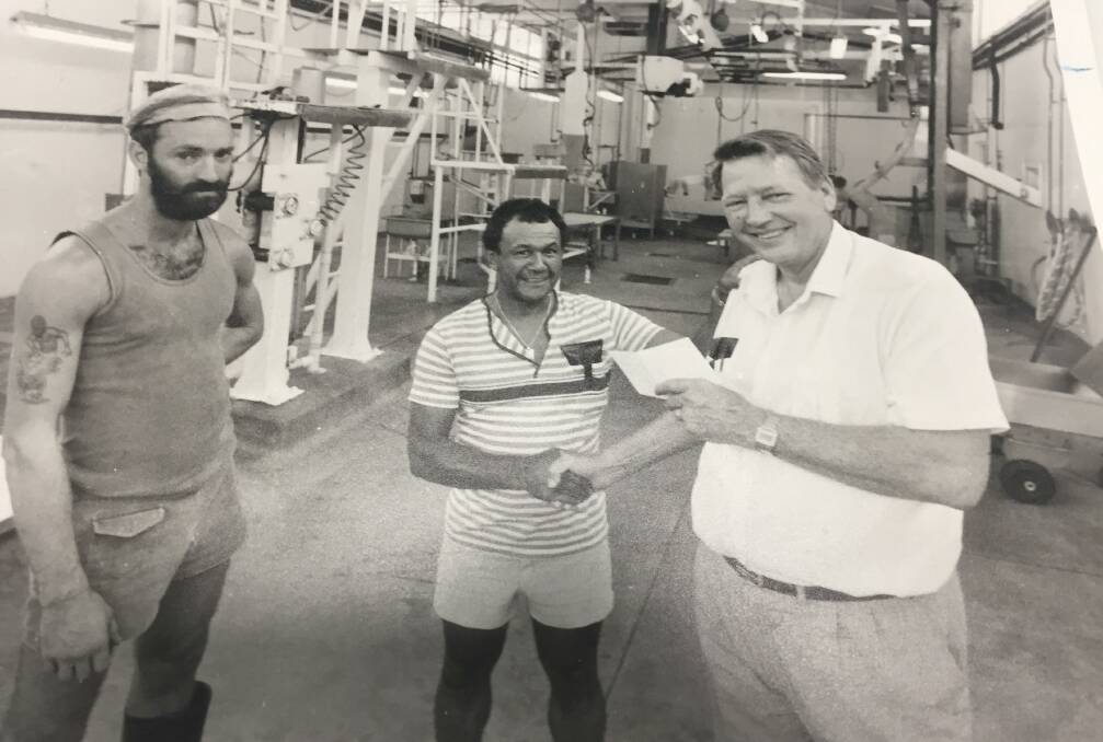 BACK TO THE '80s: Owner of the Northern Territory's Mudginberri abattoir, Jay Pendarvis, with meatworkers. Photo: Vern Graham