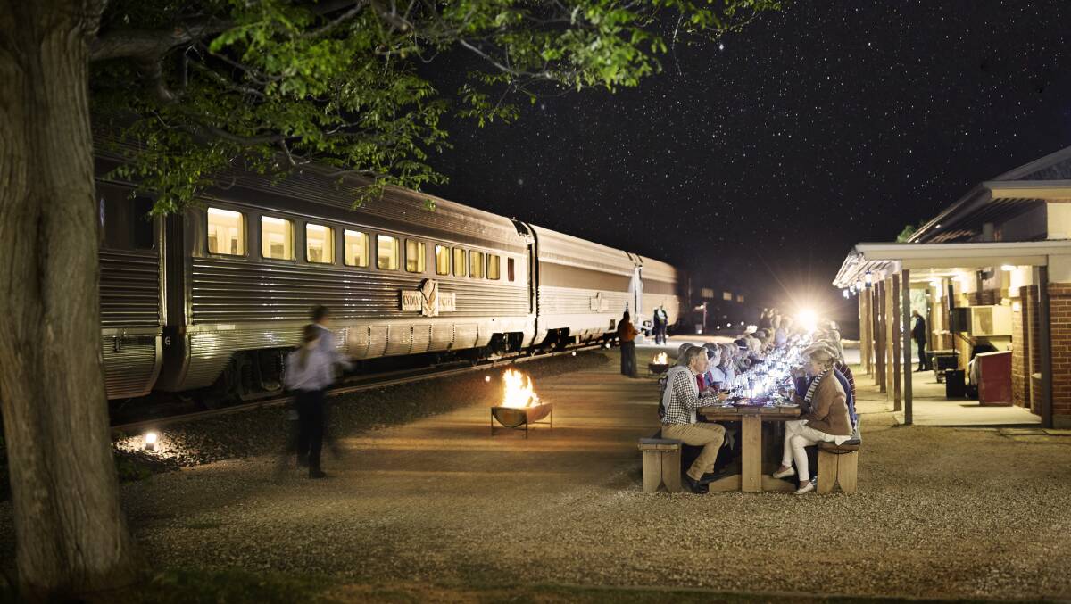 Indian Pacific travellers make a stop for dinner under the stars at Rawlinna in WA.
