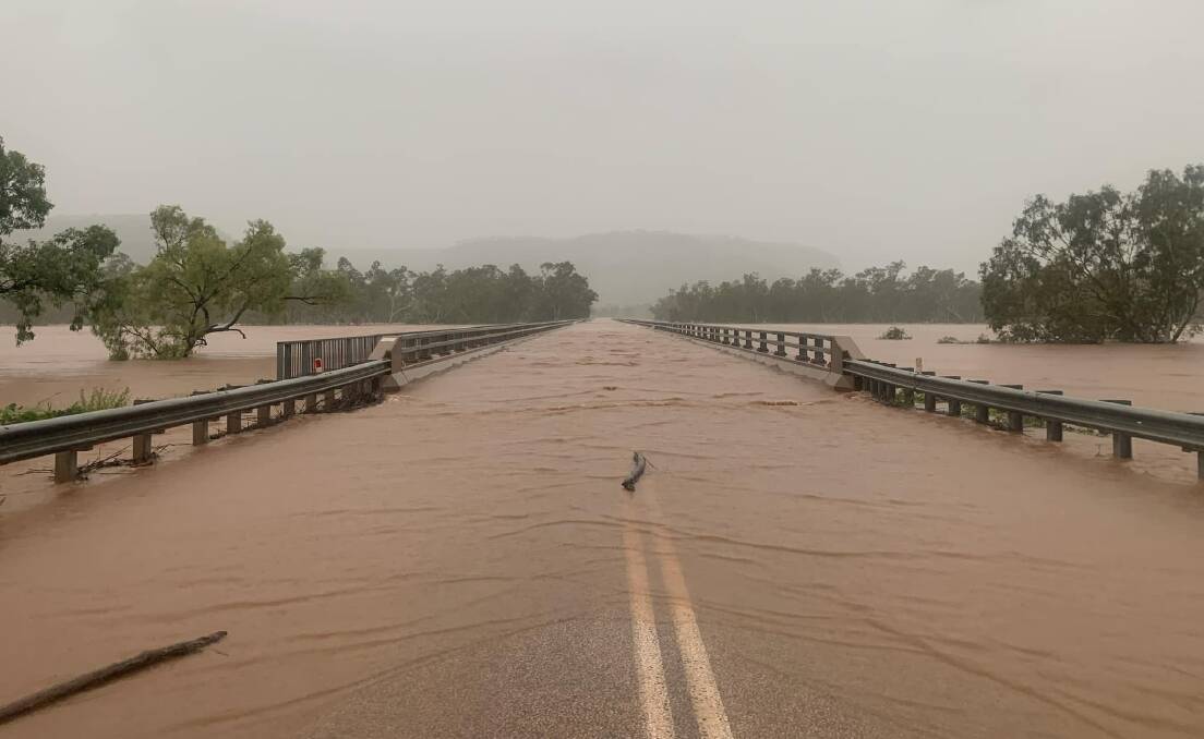 The flooded Victoria River has buried the crossing under several metres of flood water in what authorities are calling a record event. Picture: Victoria River Roadhouse.