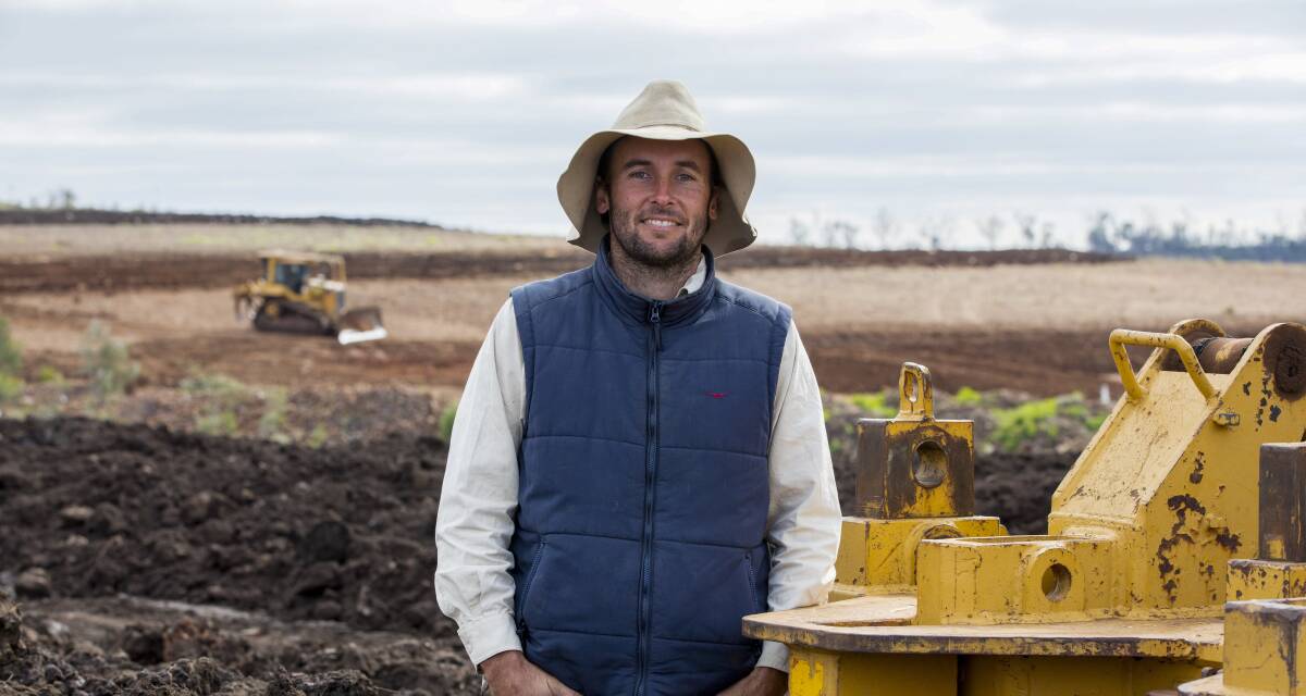 AN OBVIOUSLY pleased John Cranney, Combo, near North Star, as Soil Conservation Services builds bays on his property earlier in the year. As each bay was finished it was planted to barley throughout June into early July. All photos: MEL JENSON