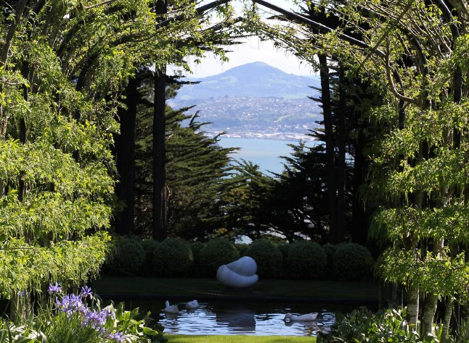 A cleverly placed pergola brings a distant mountain into the garden at Larnach Castle, Dunedin, NZ (www.larnachcastle.co.nz/) 