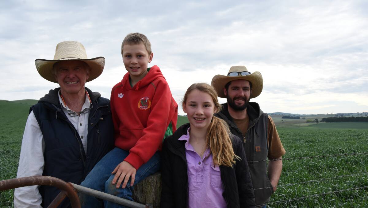 Chris Stonestreet, grandson Levi Howarth, 10, granddaughter Chelsea Howarth, 12, and son Rory. They're standing in a crop of Triticale planted in April. See On Farm's report about Triticale p31. Photos Dan Pedersen.