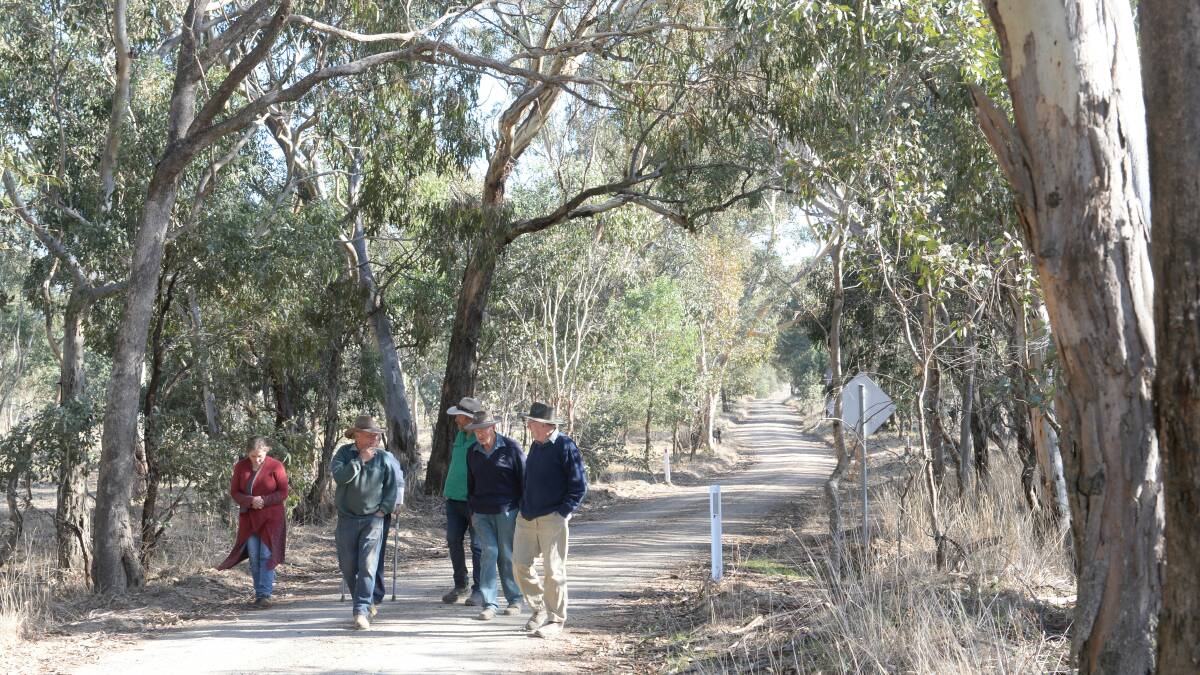 Local landholders walk along Whitefields Road. Whitefields Rd is to be the "access road" for the Coppabella wind farm west of Yass, but a motion passed by Yass Valley Council on Wednesday night asks that the road not be used to haul heavy equipment to the project.