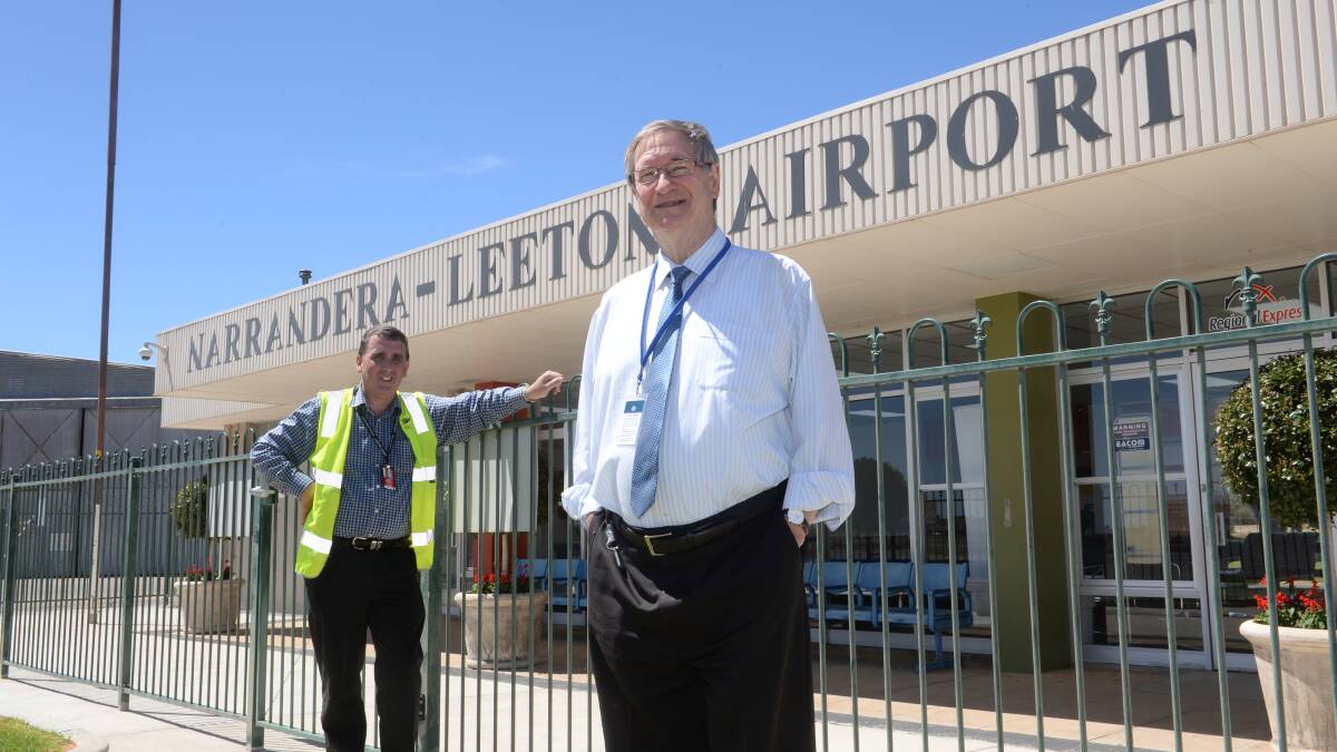 Narrandera Shire Council economic development manager, Peter Dale and (at back) traffic and airport officer, Andrew Pearson, pictured at the Narrandera-Leeton airport.