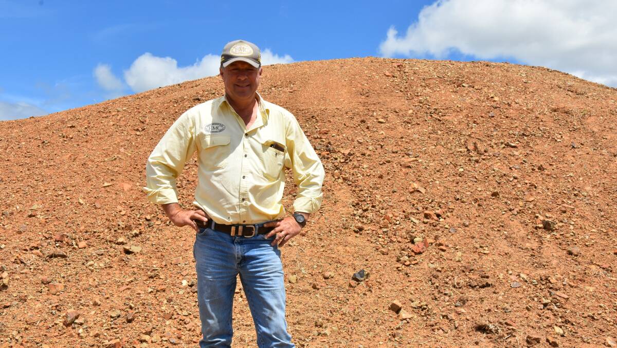 Ben Emms in front of his silage pit in hill country at Lyndhurst.