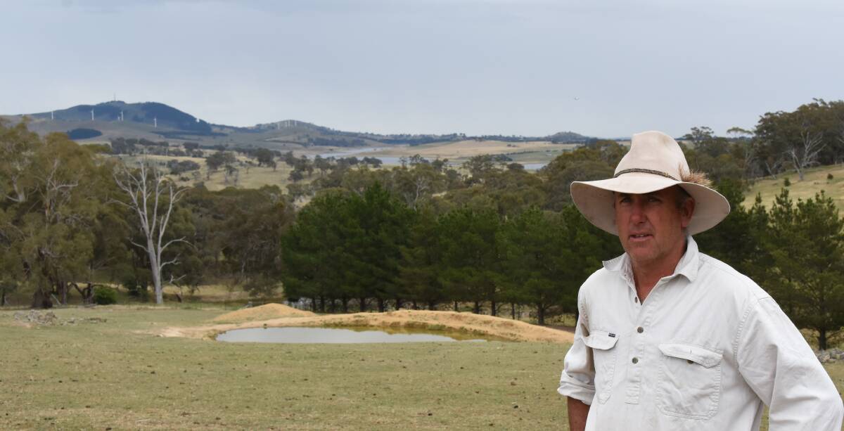Dub Price stands at the back of his home on "Weemala". In the far distance is Carcoar Dam, a reservoir he believes will be threatened by a proposed new gold mine at the headwaters of the Belubula River.
