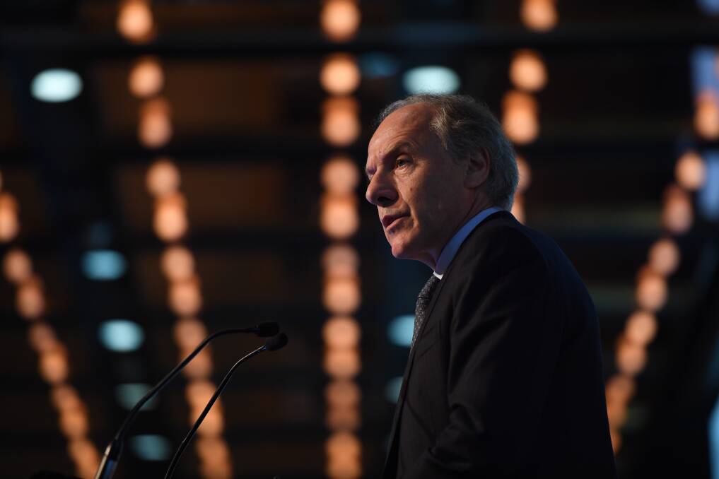Australia's chief scientist Alan Finkel speaks at the Australian Financial Review's national energy summit in Sydney on Monday. One of the reasons for a recent dip in business confidence is concern about energy prices.