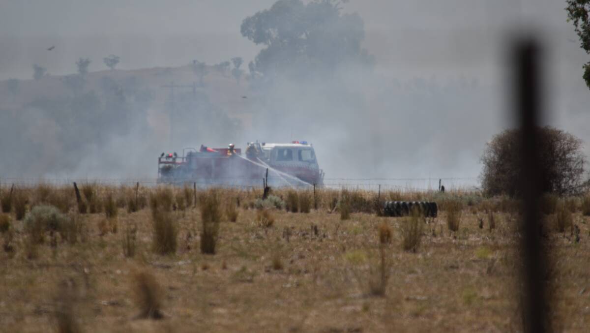 A GUNNEDAH crew works to extinguish a grass fire in 2018. Photo: Ben Jaffrey