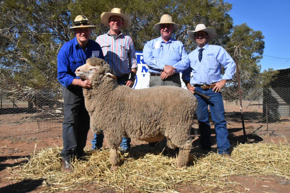 One of two top-priced rams, which fetched $4500, at Darriwell Merinos is pictured with Darriwell principal Russell Jones, buyer and volume buyers Gus Shannon and Peter Morley, Boomey, Molong and auctioneer Jason Hartin, of Hartin Schute Bell.