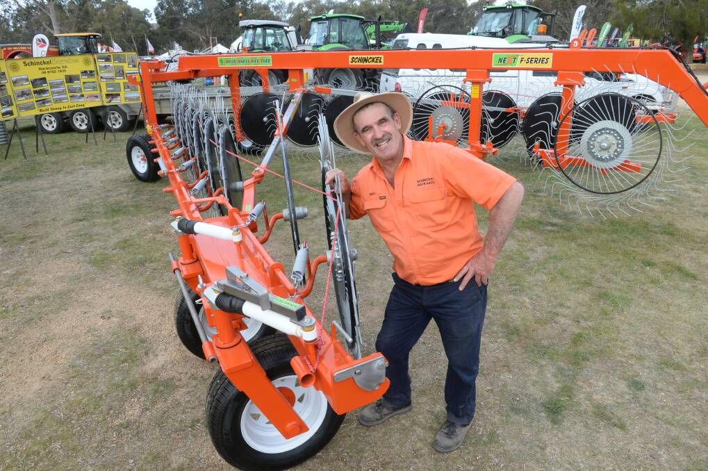 Simon Schinckel with his 16-wheel rake that won Machine of the Year at the Henty Machinery Field Days this year.