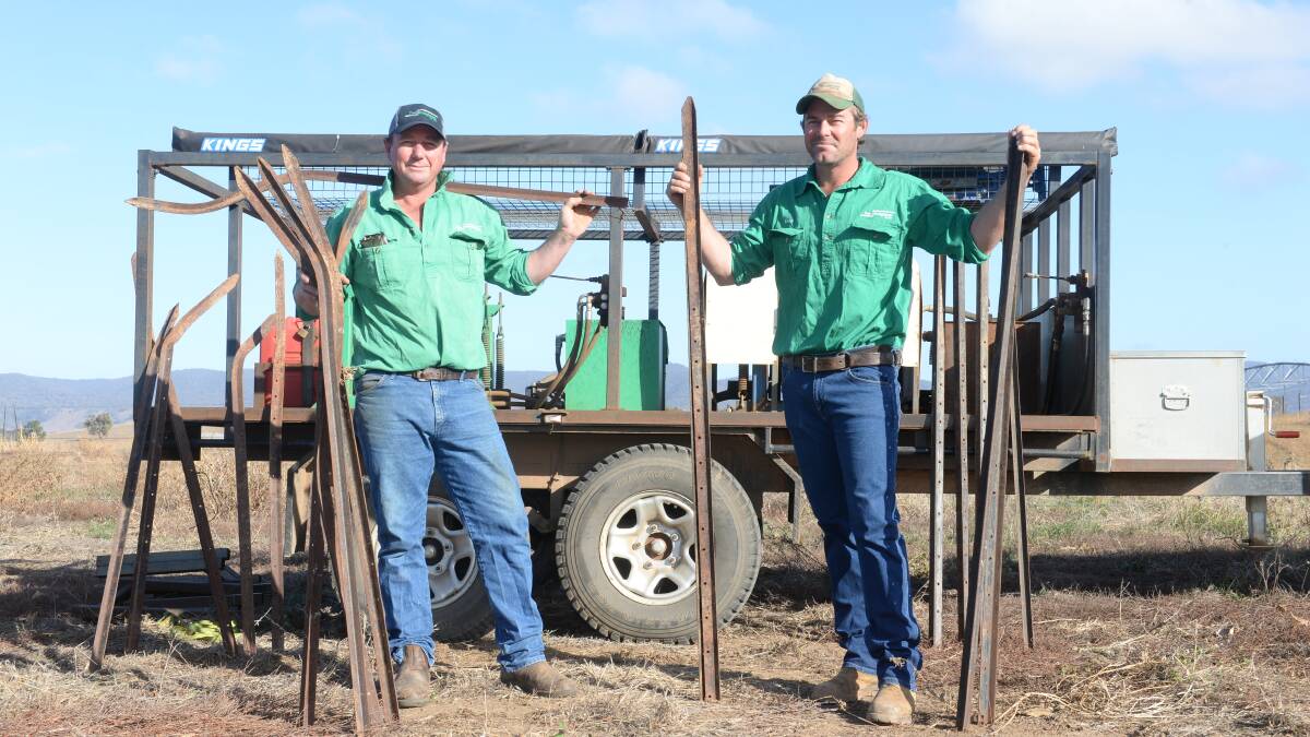 Daryl Irving and Dan Robinson of Post Straightener Pty Ltd, Mudgee, with contracting machines on display. The machine is carving its own market niche.