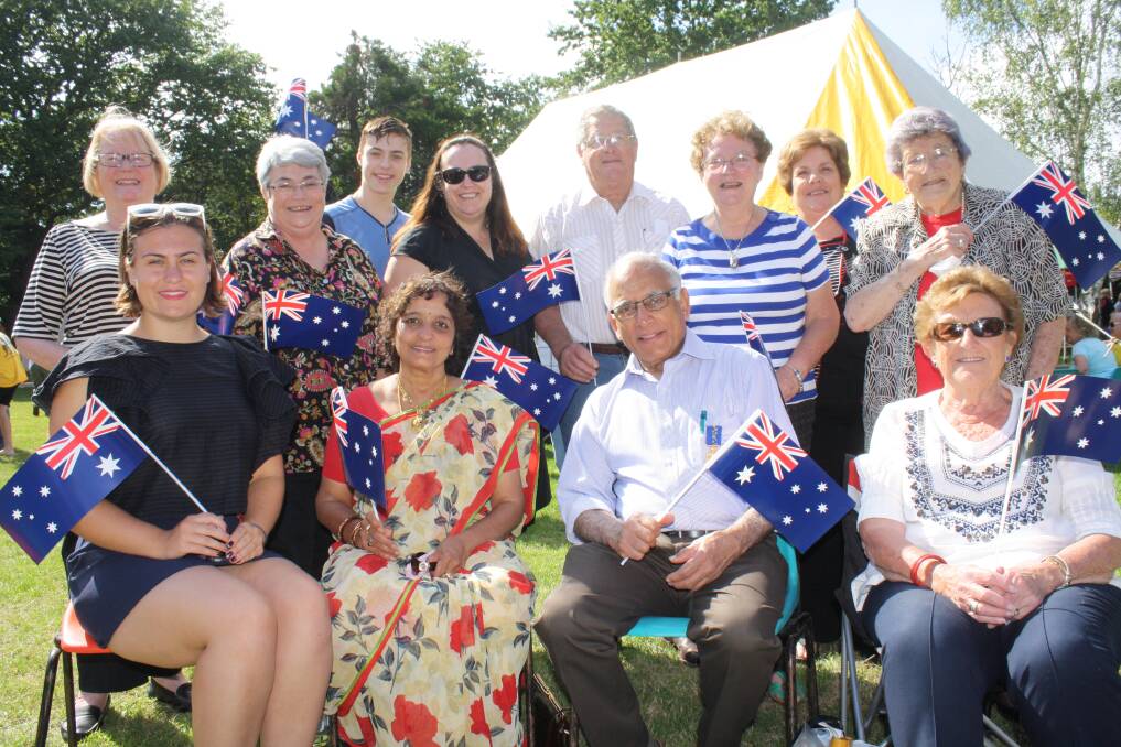LONGEST-SERVING: Dr Ramaswamy Thangavelu and wife Chandra (centre, seated) with many friends at a recent Australia Day award ceremony. Photo: Bronwyn Haynes