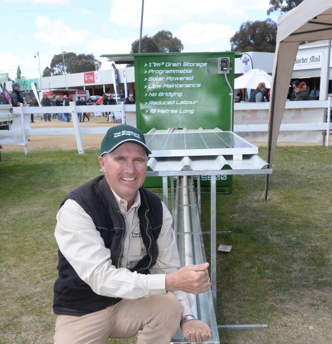 Justin Dunn with his automated sheep feeder, which won the Henty Machinery Field Days Agri-Innovator Award.
