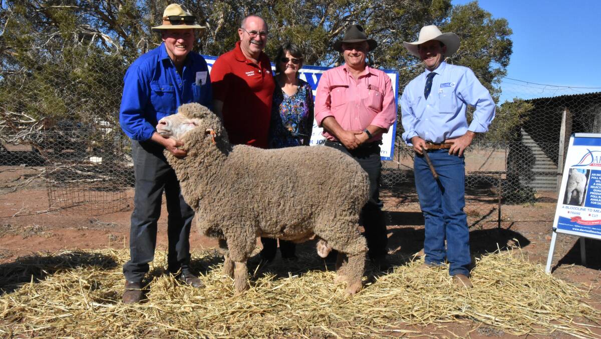 Darriwell Merinos principal Russell Jones with buyers of one of the top-priced rams Bruce and Val Burbidge, with Elders stud stock agent Scott Thrift and auctioneer Jason Hartin, of Hartin Schute Bell.