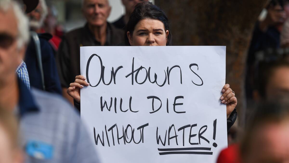 Jessica Schifferle, from Berrigan, makes her thoughts clear about water during a 'Can the Plan' rally in Albury last year.