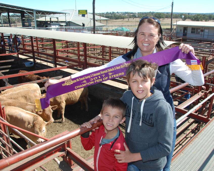 Amanda, Will and Ted Bonner, Eukey via Stanthorpe, with their grand champion pen of Charolais-cross steers at the George & Fuhrmann Warwick Bullock and Steers Show and Sale.