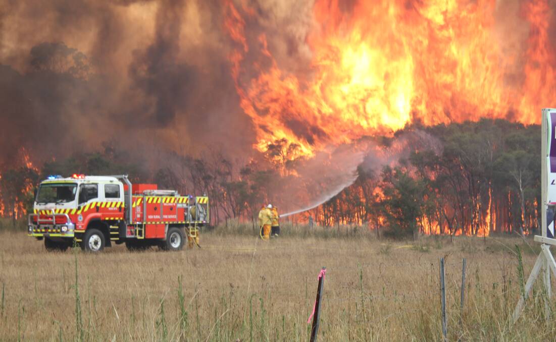 NSW Rural Fire Service volunteers fighting a fire at Charmhaven on the Central Coast on New Year's Eve. Picture: Selwyn Cox 