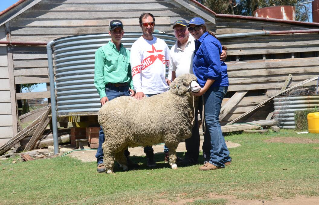 Nutrien Armidale agent Jack Simmons Buyers James and Jim Ferguson and vendor Sophie Watson with the $3300 top priced ram.