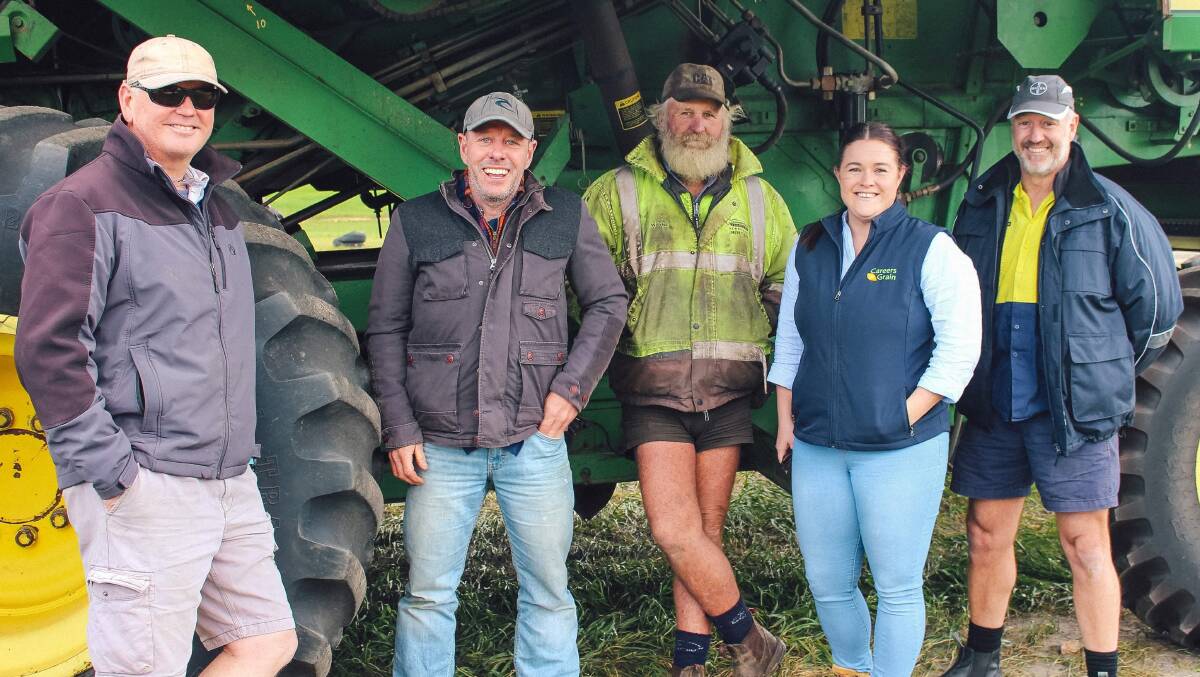 Pilots Dean McKie (left) and Stuart Ralls with 2 Workin Oz trainer Wayne Lightbody, GIWA Careers in Grain program manager Kayla Evans and pilot Steve Barnden as the pilots are taught to drive harvesters.