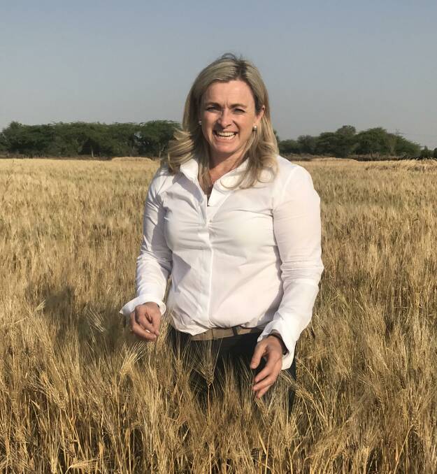 Australian Export Grain Innovation Centre barley technical markets manager Mary Raynes in a six-row barley crop in India. AEGIC has been working with the Indian malt sector to highlight how Australian barley could be used in the subcontinent.