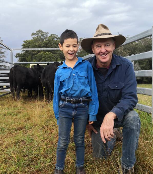 In the blood: John Wood with son Langley, who's keen to one day continue the family's purebred Angus commercial breeding operation.
