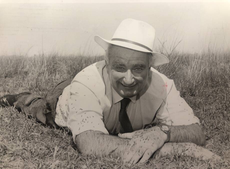 Agriculture Minister, Ian Armstrong in 1991, gets down to earth with a week old plague of locust hoppers near Gunnedah.
