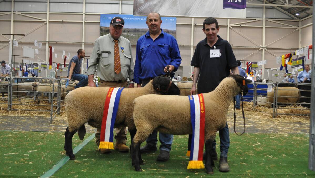 Greg Good and his son William (with judge Josh Milton, Allora, Qld, left) during Sydney Royal Show, 2019.