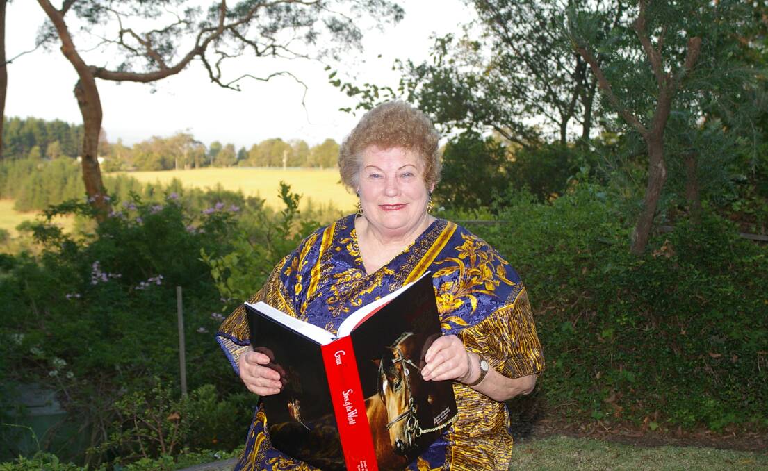 Leading Thoroughbred pedigree authority, Jennifer Churchill, with her much loved published book on world Thoroughbred stallions, "Great Thoroughbred Sires Of The World", at her home at Kurrajong Heights in 2006. Photo: Virginia Harvey