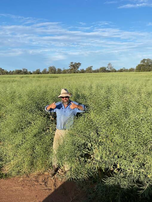 James Nalder, in one of his bumper canola fields, is enjoying the good season and prices. Photo: Emma Nalder