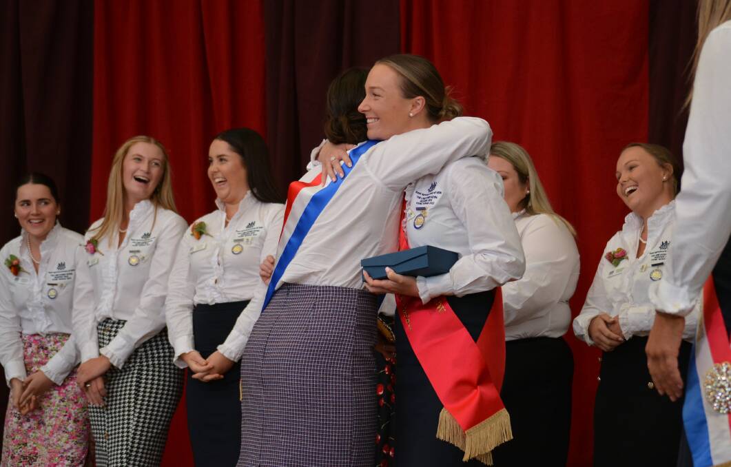 The Land Sydney Royal AgShows Young Woman embraces runner-up Jess Towns, Moree, during the presentation.