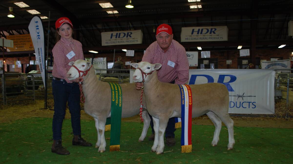 Adelaide Wall, 11, and her father, Mick, Borrehma White Suffolks, Braidwood, with their reserve and grand champion White Suffolk ewe exhibits.