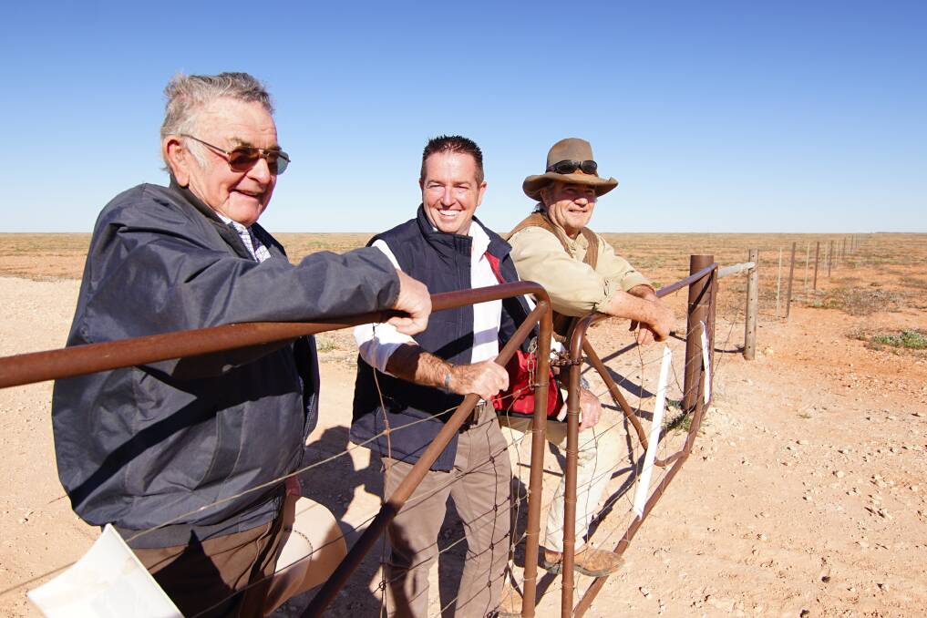 Minister for Regional Transport and Roads Paul Toole, looks across the new Silver City Highway sealing from the property of graziers are Jim O'Connor senior and his son, also Jim. Photos and story supplied.