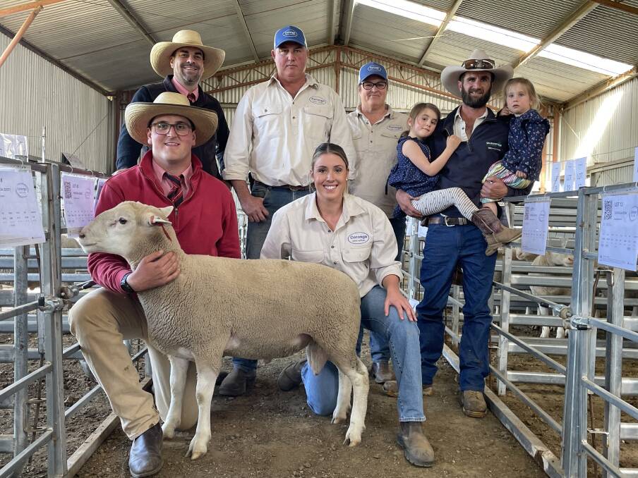 Front: Alex Madden, Edlers, and Olivia Jackson, Coronga White Suffolks, Orange. Back: Marty Simmons, Elders, James Jackson and Kirrily Rourke, both of Coronga, and buyer, Wade Peatman, Batemans, Orange, with his two daughters, Poppy, 5, and Mave, 3, and the top-priced ram. Photo Andrew Norris