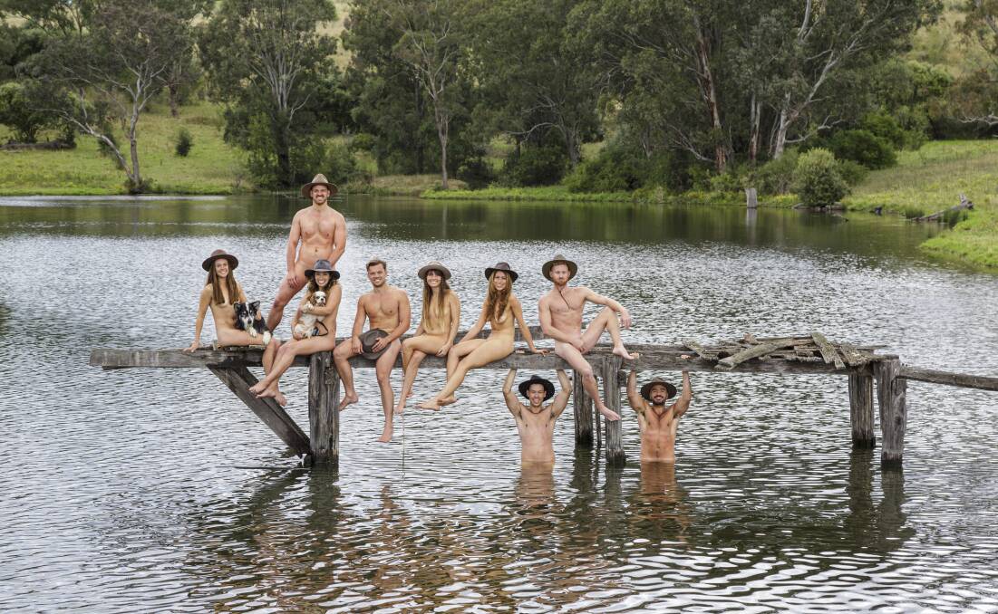 The students in this year's charity calendar are all third year doctor of veterinary medicine program students, photographed here in a lake on Mayfarm Farms, Camden.