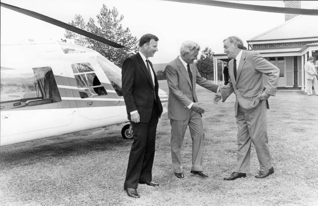 THE TWO JOHNS: Chairman of Rural Press, John B. Fairfax (left), and  managing director, John Parker (right), farewell the then Prime Minister, Bob Hawke, after he made a flying visit to the company's North Richmond headquarters in 1991.