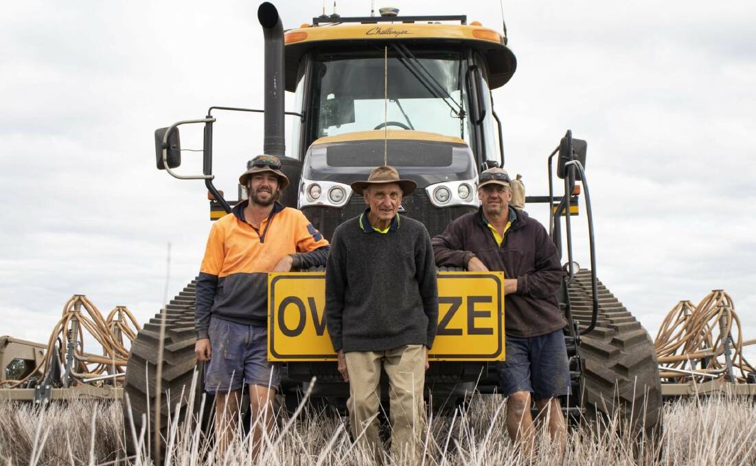 Joel (from left), Rodney and Stephen Hatty on their cropping operation near Matong.