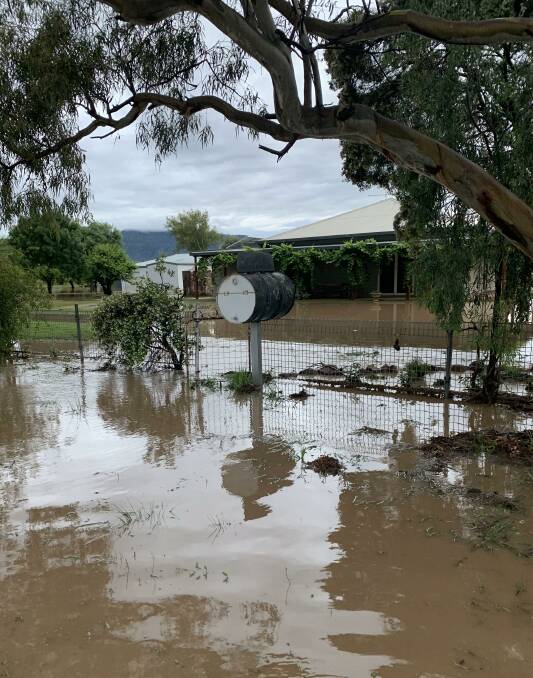 Currabubula Creek floodwater laps the verandah at "The Park", Piallaway, during one of the biggest flows of the creek in living memory. Photo: Amy Perfrement