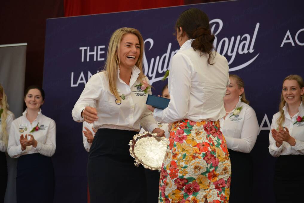 Winner of The Land Sydney Royal Agshows Young Woman 2022, Molly Wright, Peak Hill, celebrates with runner up, Imogen Clarke, Nowra. Photo: Andrew Norris